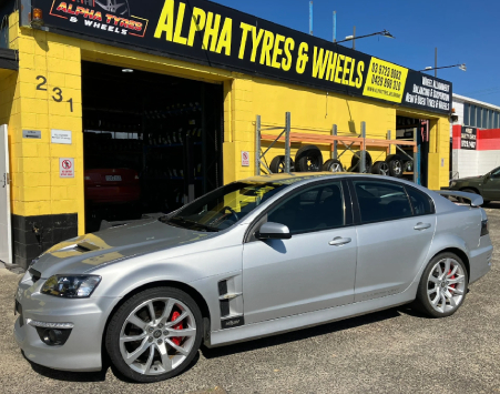 Car in front of Alpha Tyres & Wheels Workshop