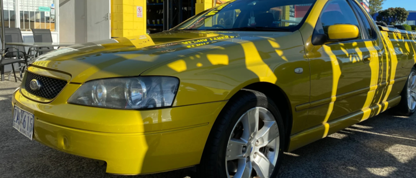 Used tyres fitted in yellow car by Alpha Tyres & Wheels